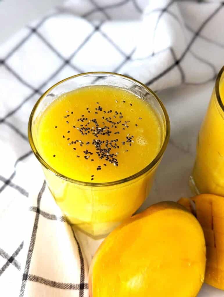 Top view of a healthy mango juice with chia seeds topping on it