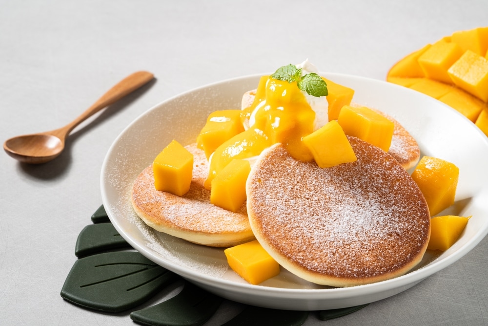 Delicious Japanese Souffle Pancake With Dice Mango Fruit Pulps 