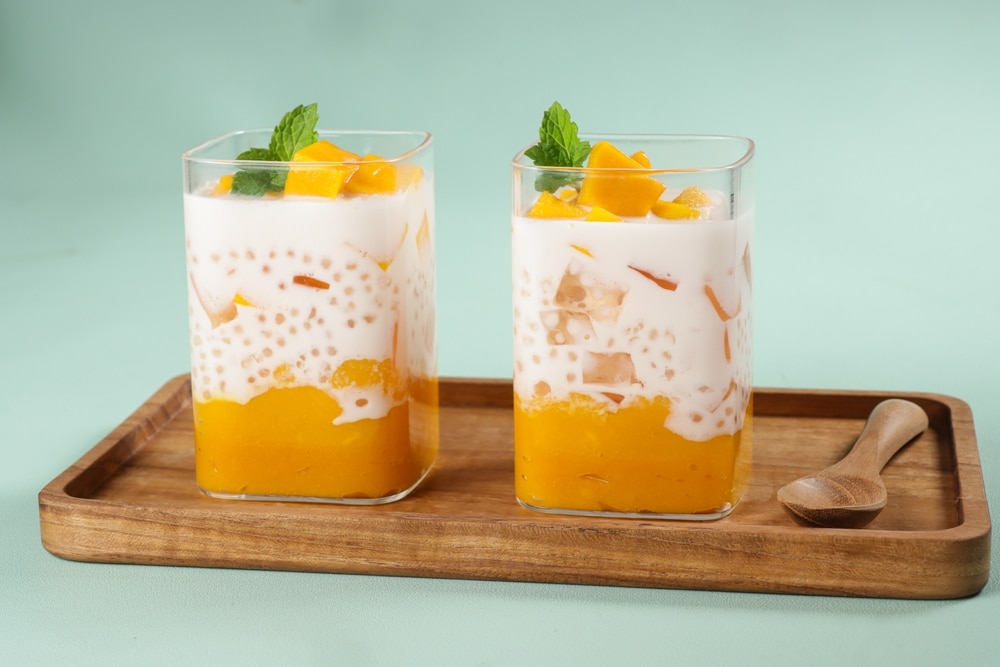 Mango Sago Dessert on a wooden tray