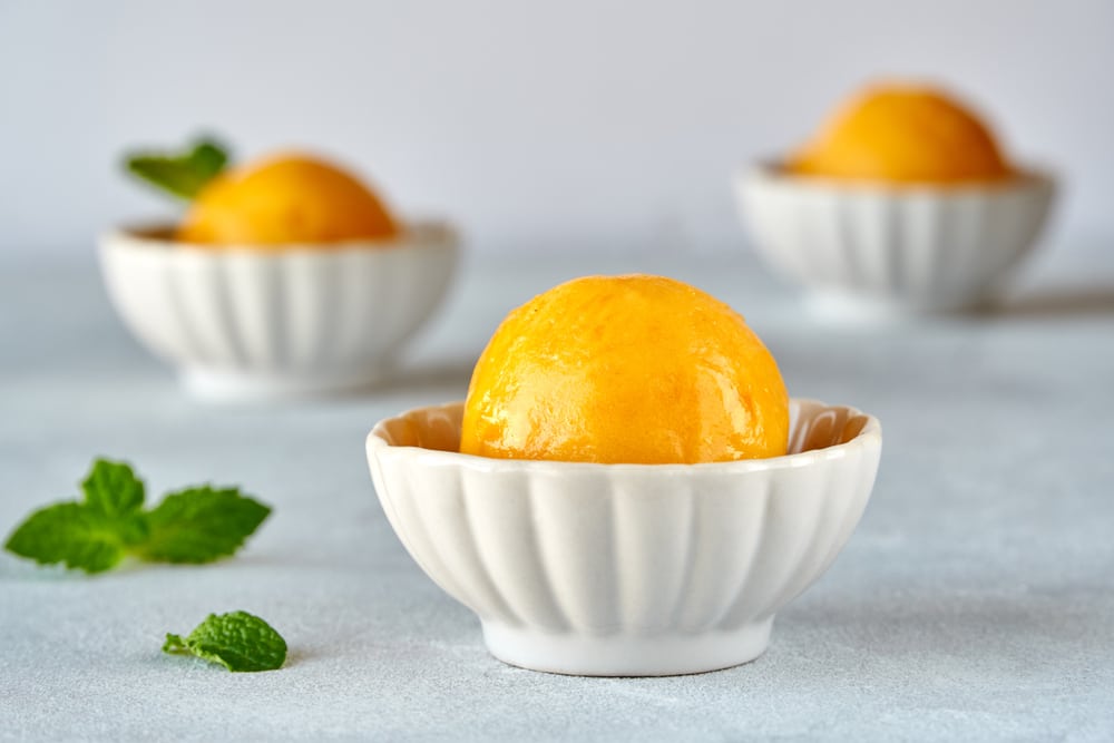 Mango Ice Cream Sorbet With Mint Leaves And Mango Fruit