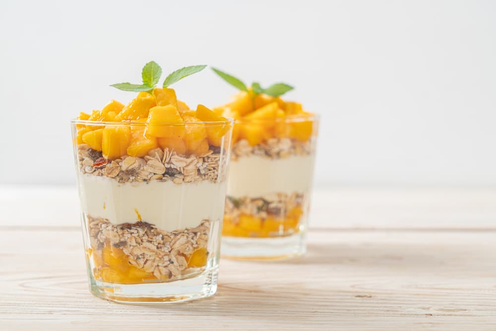 Fresh Mango Yogurt With Granola In Glass 