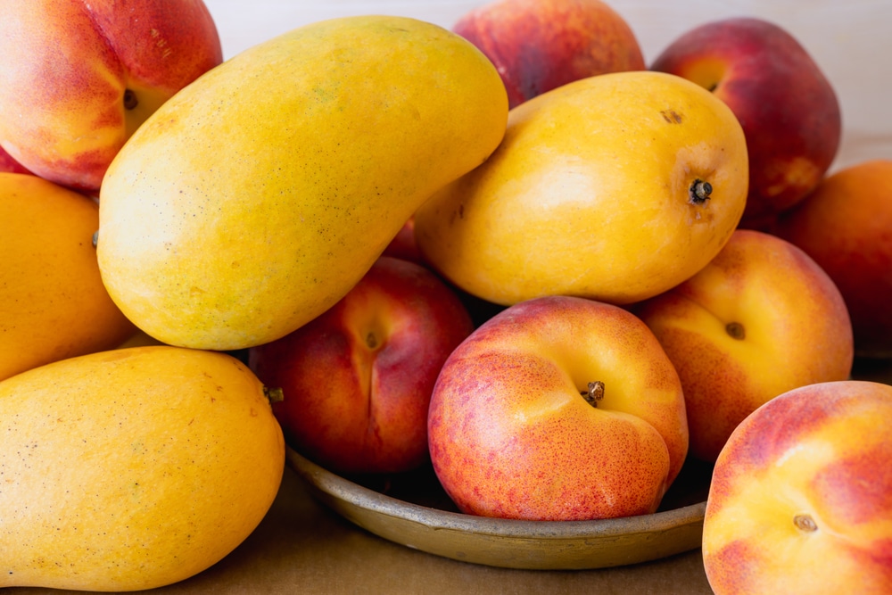 Yellow Mangoes And Peaches Fresh Ripe Organic Tropical Fruits Close