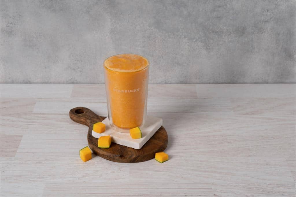 A view of mango smoothie in a starbucks glass