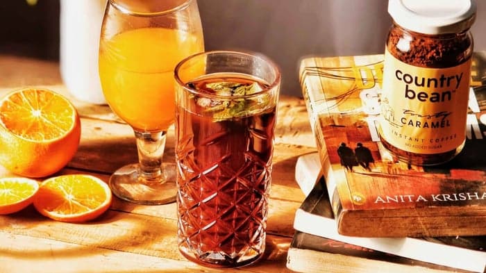 A view of mangoes and a glass of coffee